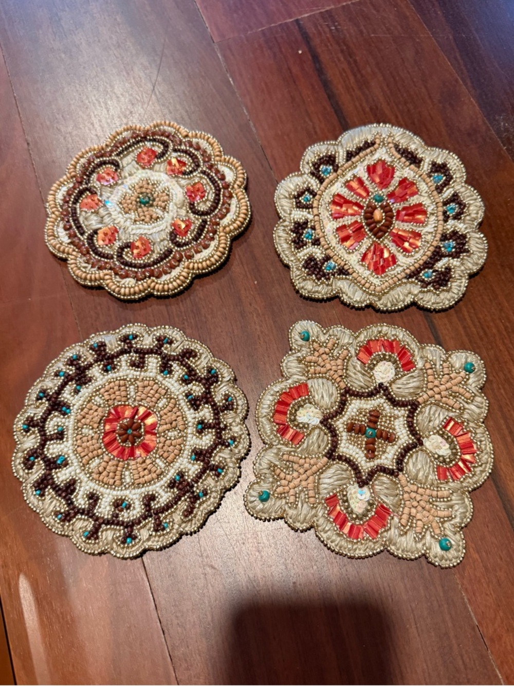 Set of 4 distinct, high end luxurious Kim Seybert vintage beaded coasters. NEW